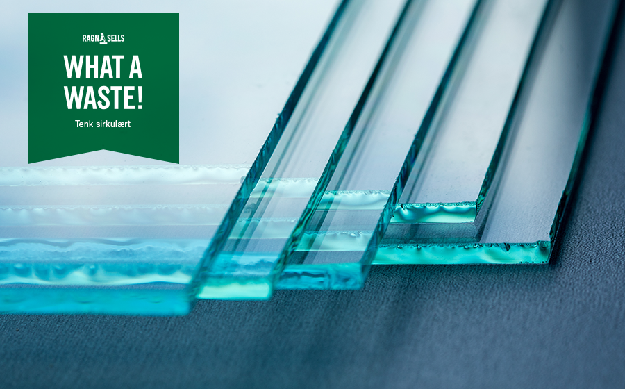 En hög med planglas och texten "what a waste"